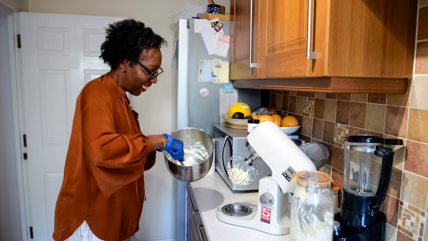 Ros mixing a batch of body care in her kitchen